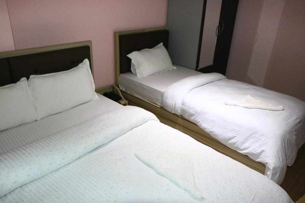 Postel nebo postele na pokoji v ubytování Hotel Samrajya Pvt. Ltd.