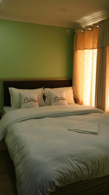 Postel nebo postele na pokoji v ubytování Hotel Samrajya Pvt. Ltd.