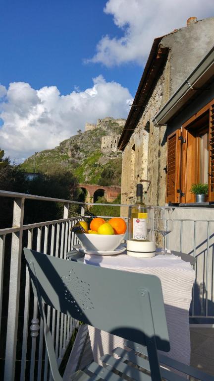 a bowl of fruit on a table on a balcony at Mare Apartment 4 in Scalea