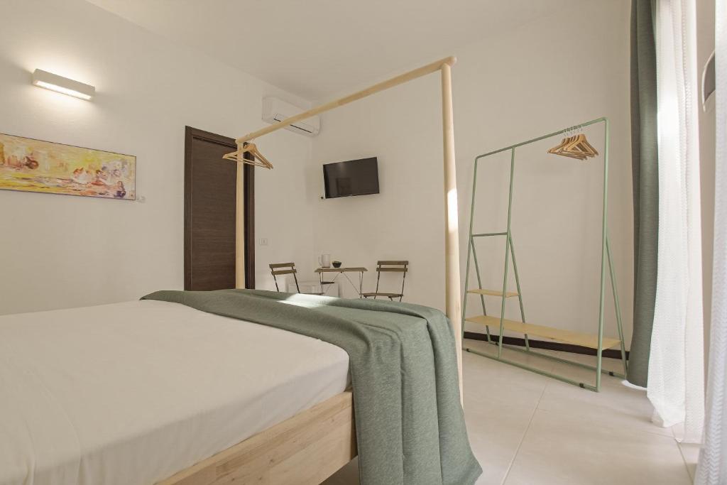 Postel nebo postele na pokoji v ubytování Cortile Baronello
