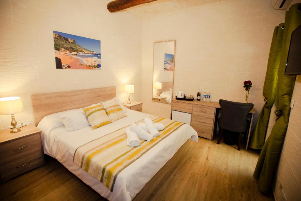 Postel nebo postele na pokoji v ubytování Soleil B&B Gozo