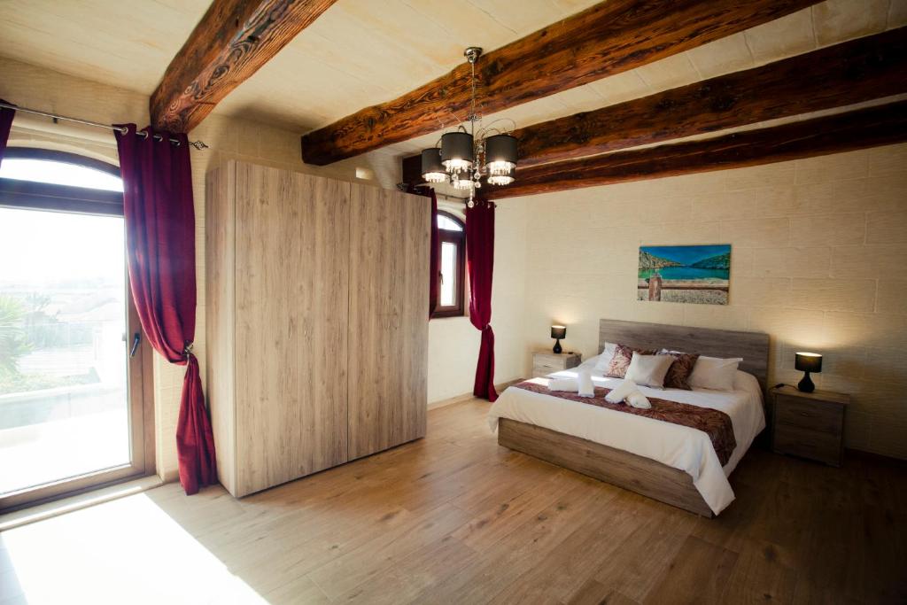Postel nebo postele na pokoji v ubytování Soleil B&B Gozo
