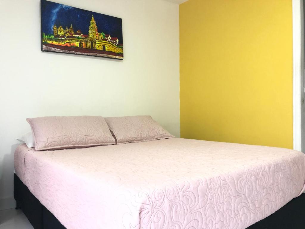 Postel nebo postele na pokoji v ubytování Hotel Balcones de Bocagrande