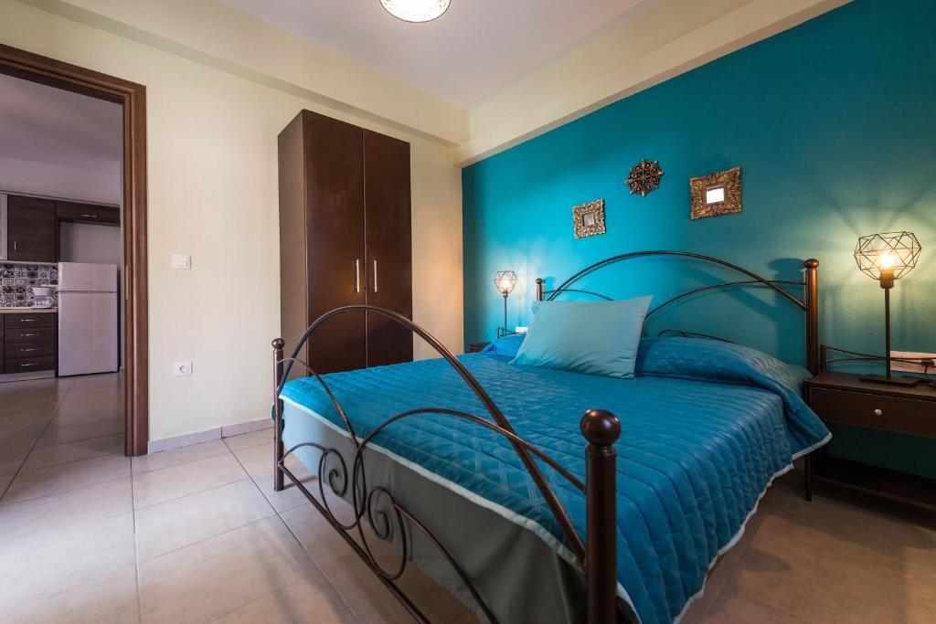 Posteľ alebo postele v izbe v ubytovaní Roxani's Apartments