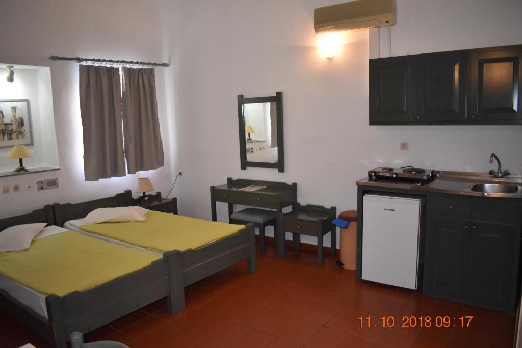 Postel nebo postele na pokoji v ubytování Vecchio Hotel