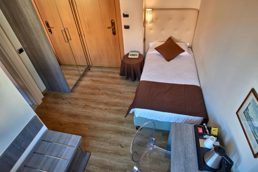 Postel nebo postele na pokoji v ubytování Hotel Bellavista