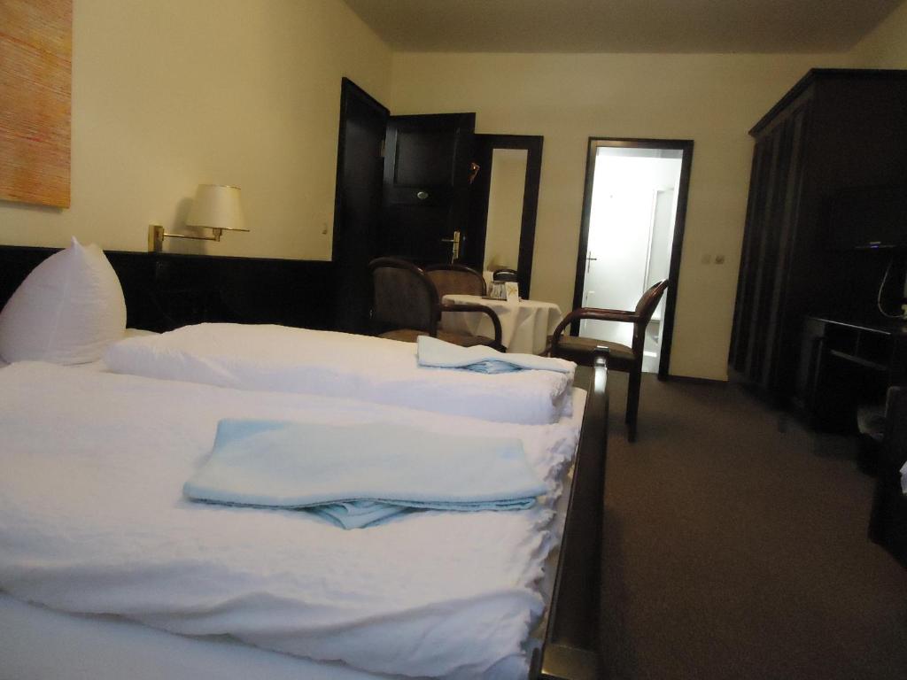 Postel nebo postele na pokoji v ubytování Hotel Marthahaus
