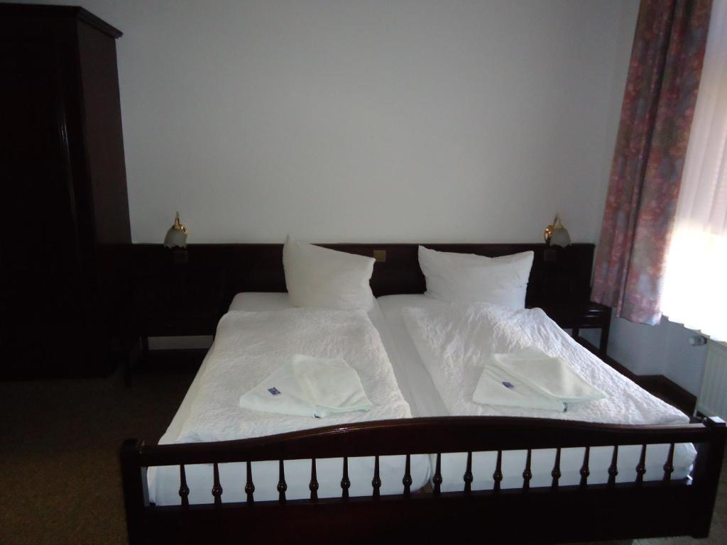 Postel nebo postele na pokoji v ubytování Hotel Marthahaus