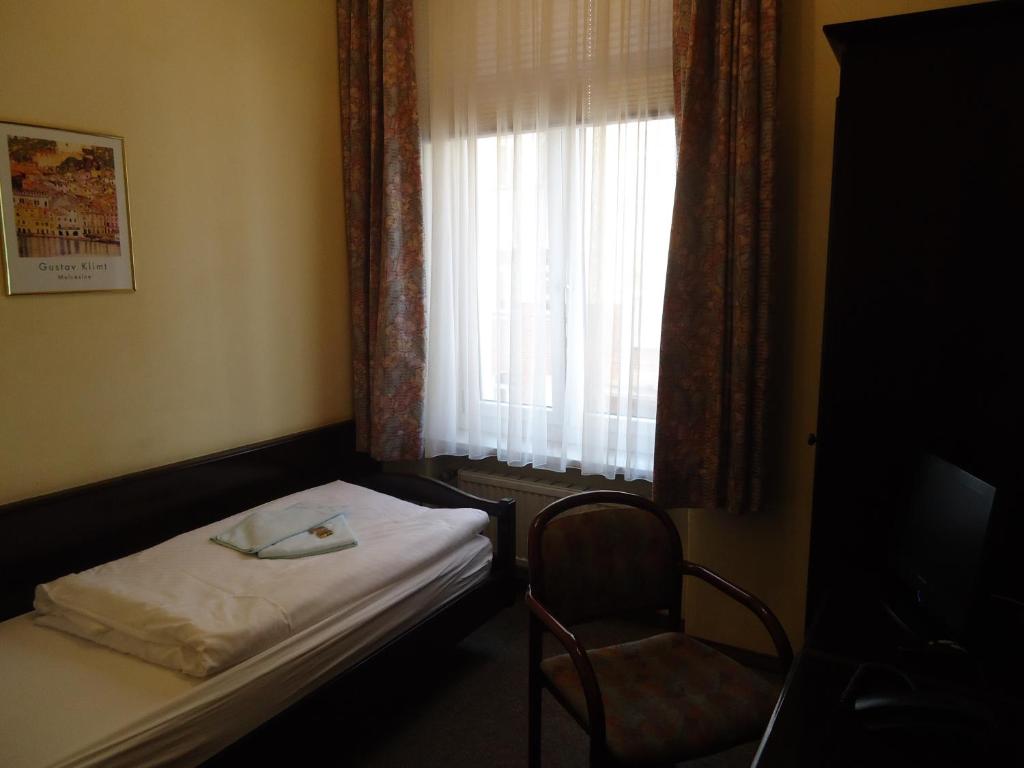 Postel nebo postele na pokoji v ubytování Hotel Marthahaus