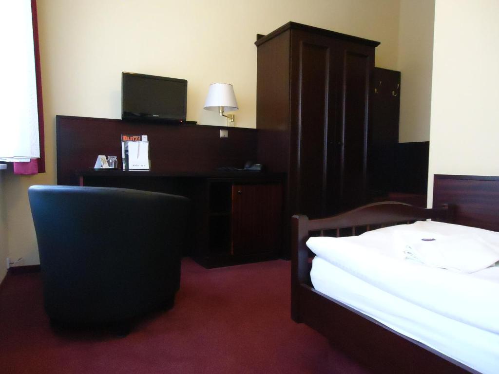 Postel nebo postele na pokoji v ubytování Hotel Marthahaus