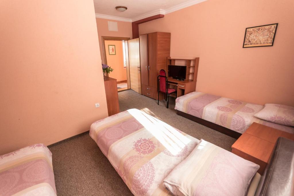 Postel nebo postele na pokoji v ubytování Hotel Drumski Raj