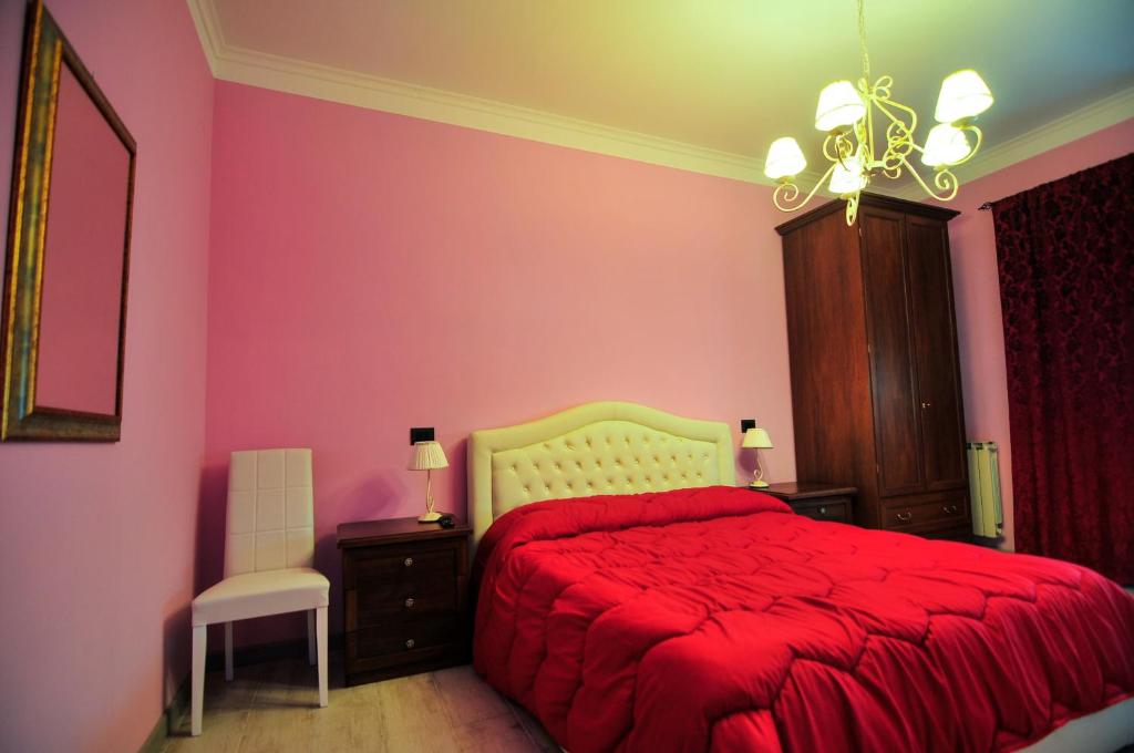 Łóżko lub łóżka w pokoju w obiekcie Casa Vacanza Katiuscia