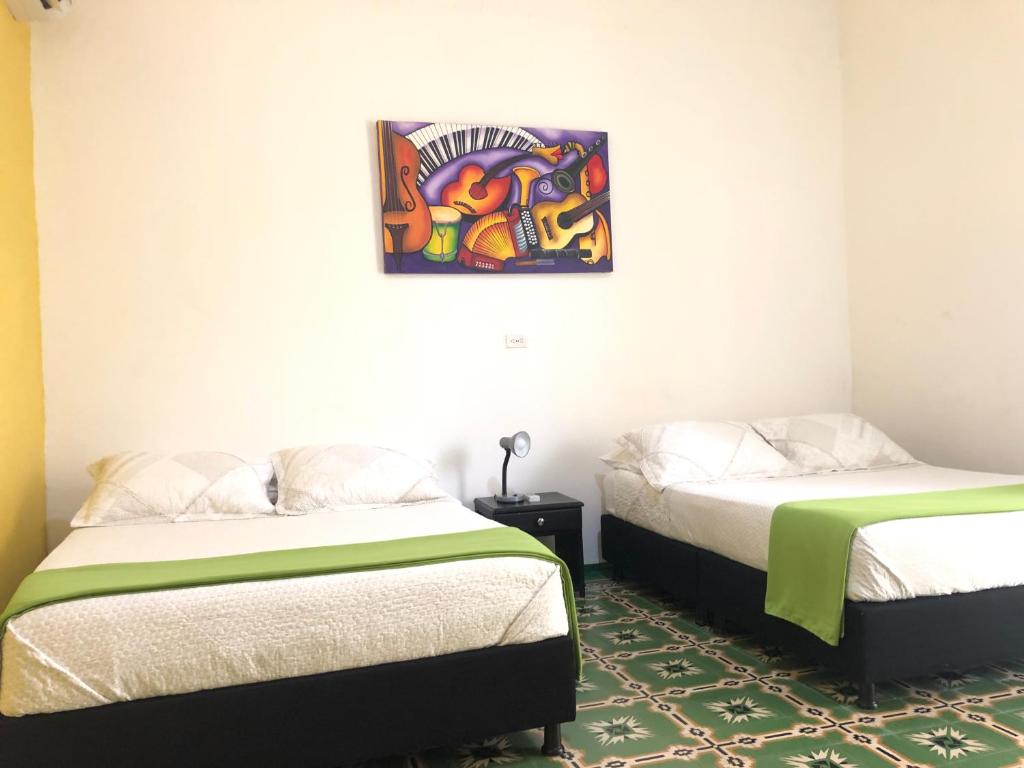 Postel nebo postele na pokoji v ubytování Hotel Balcones de Bocagrande