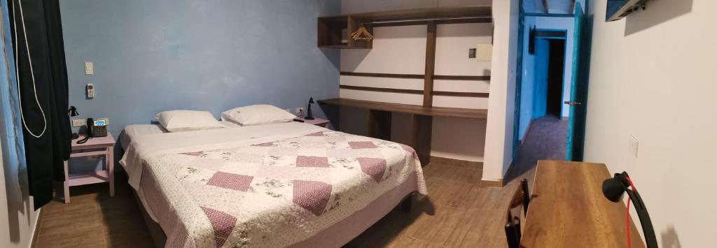 Postel nebo postele na pokoji v ubytování Hotel Villa Jazmin