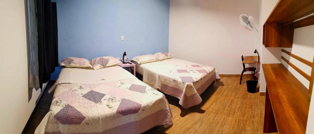 Postel nebo postele na pokoji v ubytování Hotel Villa Jazmin