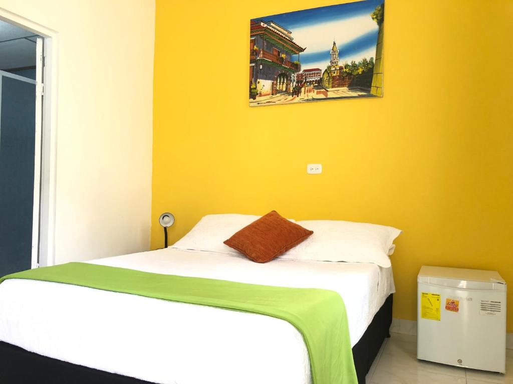 Postel nebo postele na pokoji v ubytování Hotel Balcones de Bocagrande
