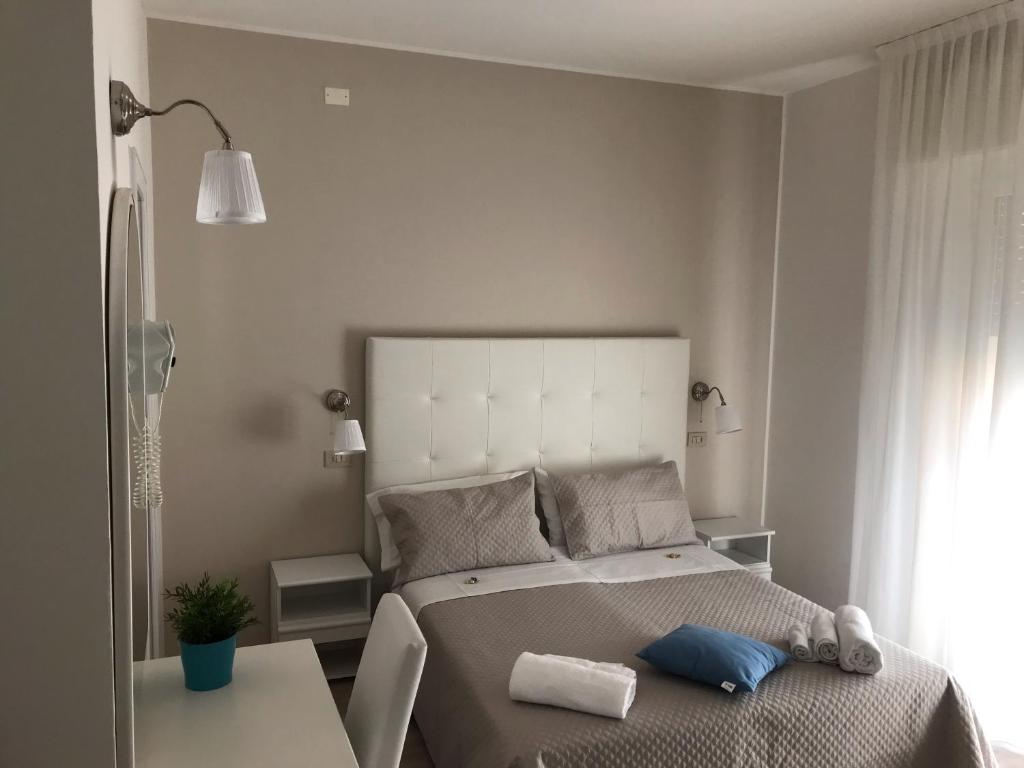 Postel nebo postele na pokoji v ubytování Hotel Vasco