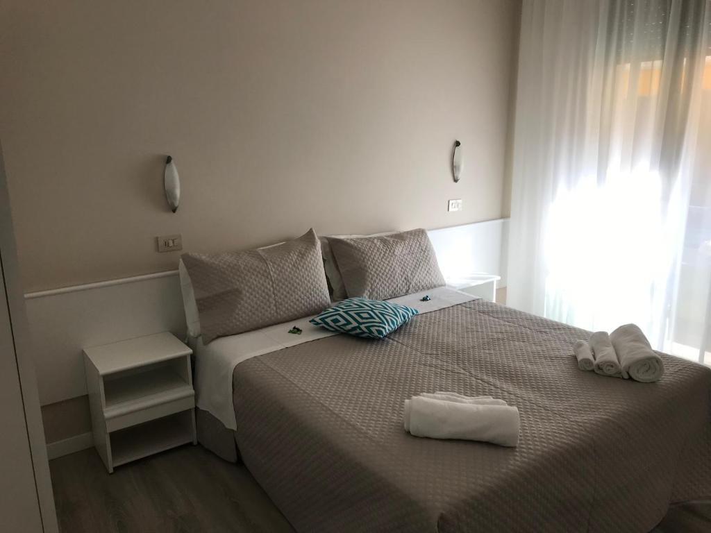 Postel nebo postele na pokoji v ubytování Hotel Vasco