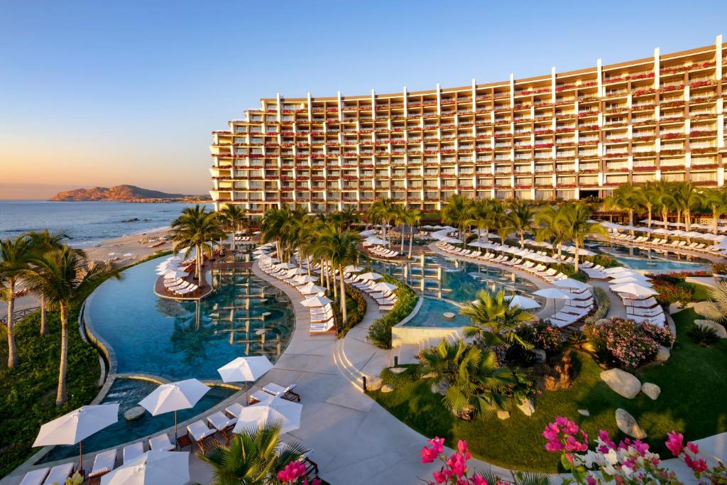 an aerial view of a resort with a pool and beach at Grand Velas Los Cabos Luxury All Inclusive in Cabo San Lucas