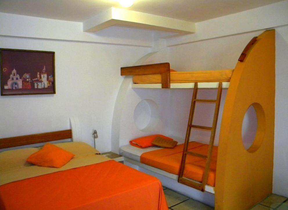 Postel nebo postele na pokoji v ubytování Hotel Cocos