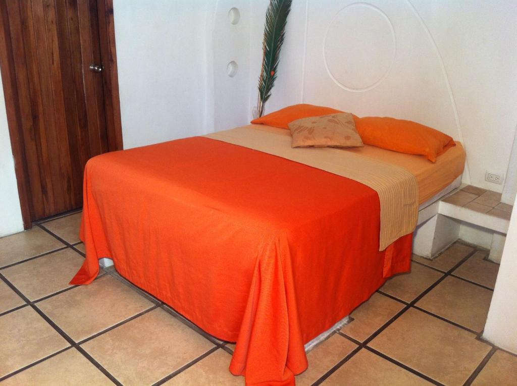 Postel nebo postele na pokoji v ubytování Hotel Cocos