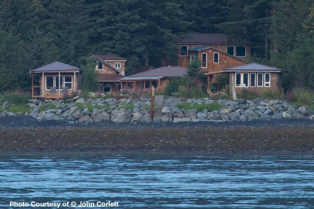 a group of houses next to a body of water at Angels Rest on Resurrection Bay LLC in Seward