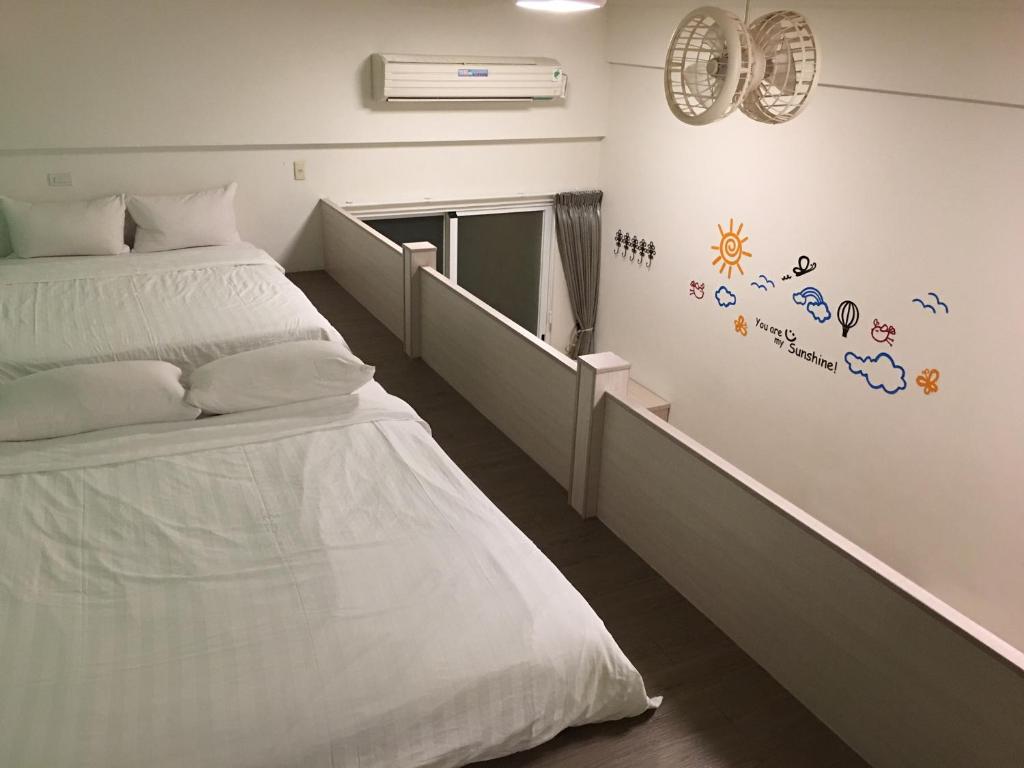 Postel nebo postele na pokoji v ubytování Moumoon B&B