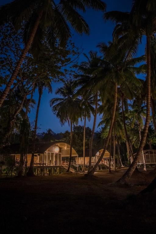 a resort with palm trees in front of it at Taj Exotica Resort & Spa, Andamans in Havelock Island