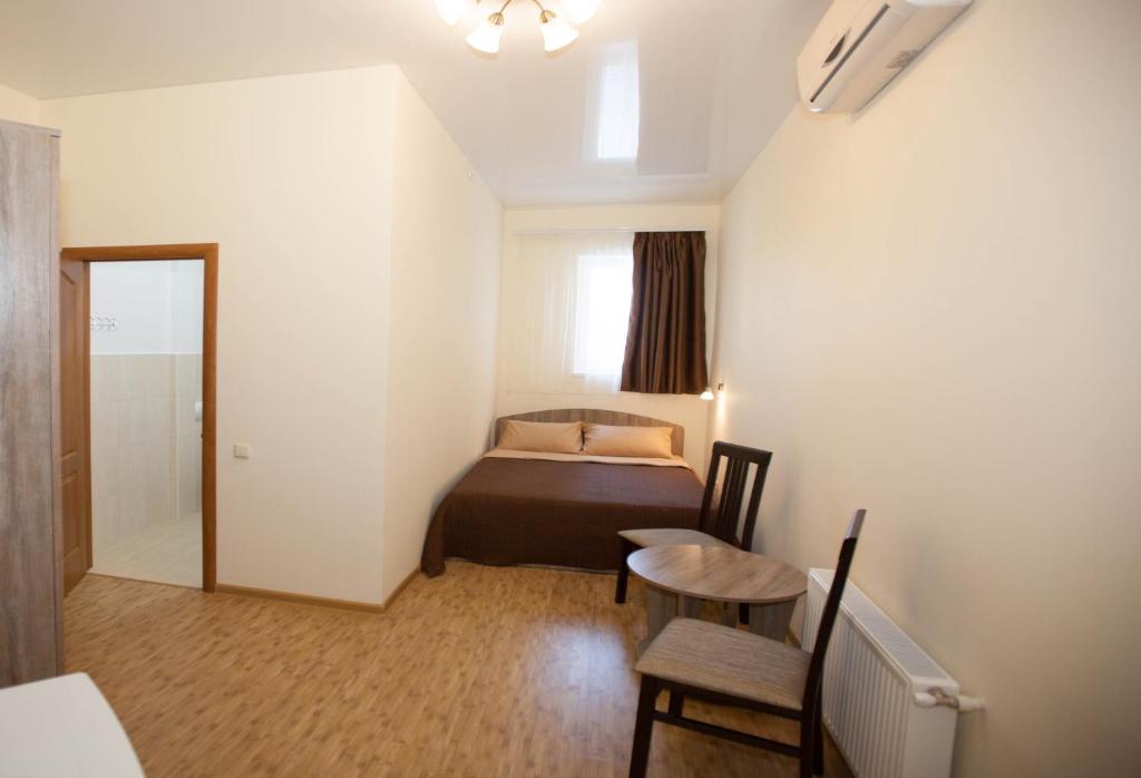 Postel nebo postele na pokoji v ubytování Arnautskiy Hotel