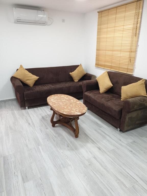 a living room with a couch and a coffee table at 2לופית in Eilat
