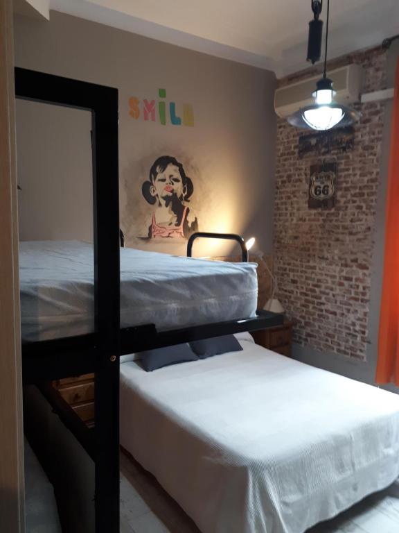 Postel nebo postele na pokoji v ubytování Hostal Hispalense