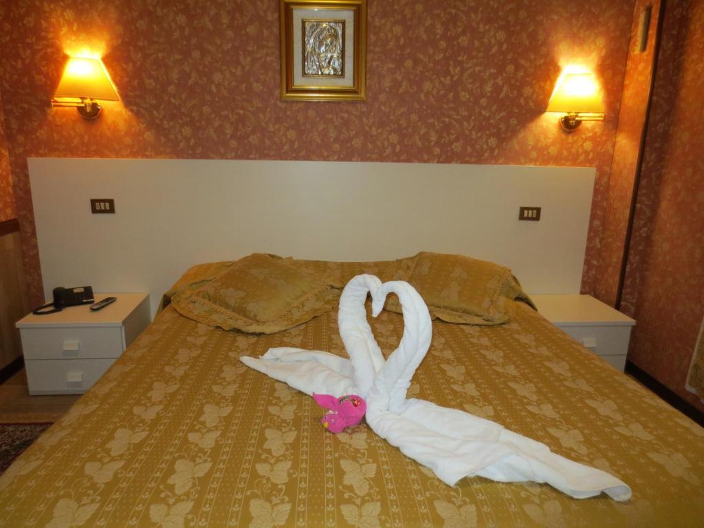 Postel nebo postele na pokoji v ubytování Hotel Italia City Center