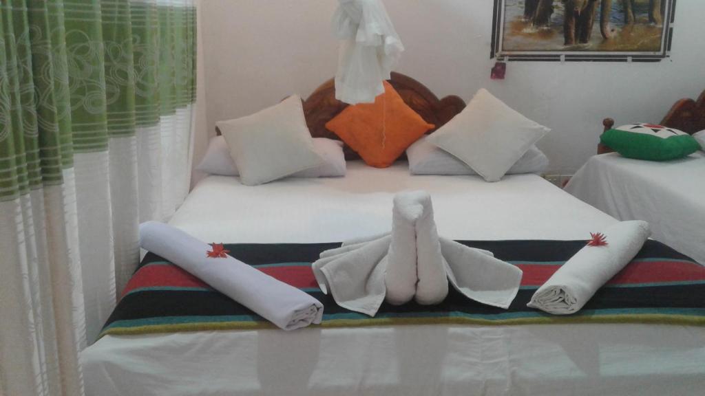 Postel nebo postele na pokoji v ubytování Kalana Homestay