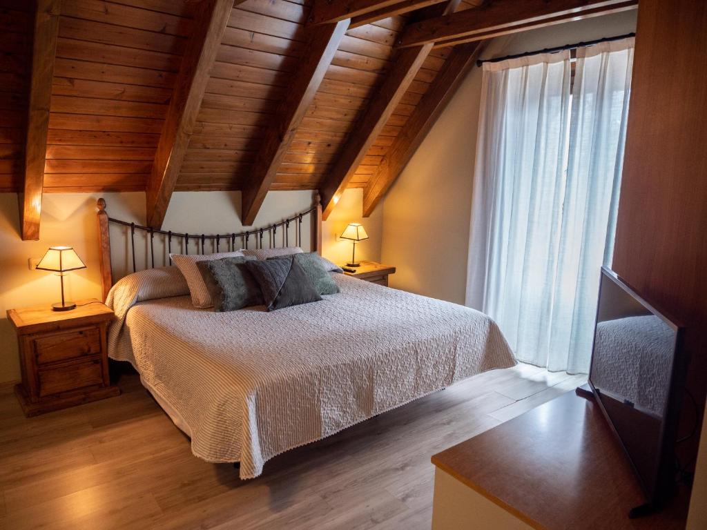 Postel nebo postele na pokoji v ubytování Peira Blanca Hotel Gastronómico