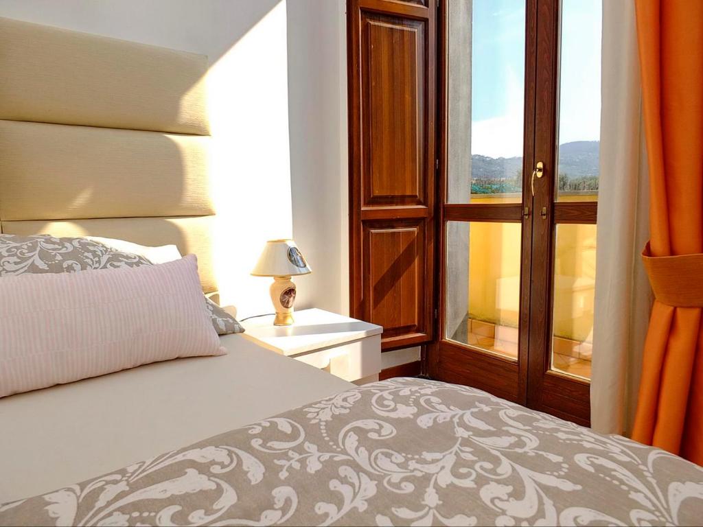 Postel nebo postele na pokoji v ubytování B&B Villa Elisa