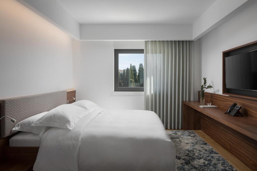 TV a/nebo společenská místnost v ubytování Hotel Milan