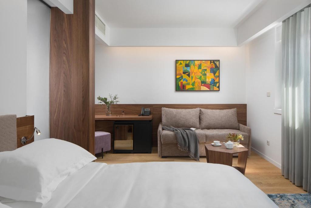 Postel nebo postele na pokoji v ubytování Hotel Milan