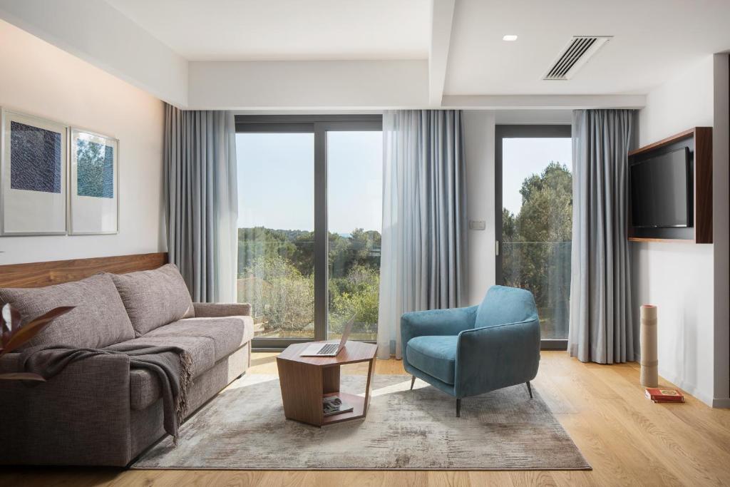 TV a/nebo společenská místnost v ubytování Hotel Milan