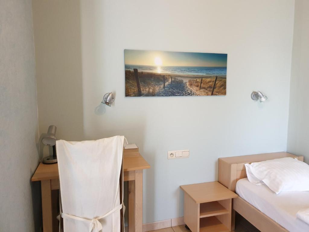 Postel nebo postele na pokoji v ubytování Hostellerie Daiseldaele