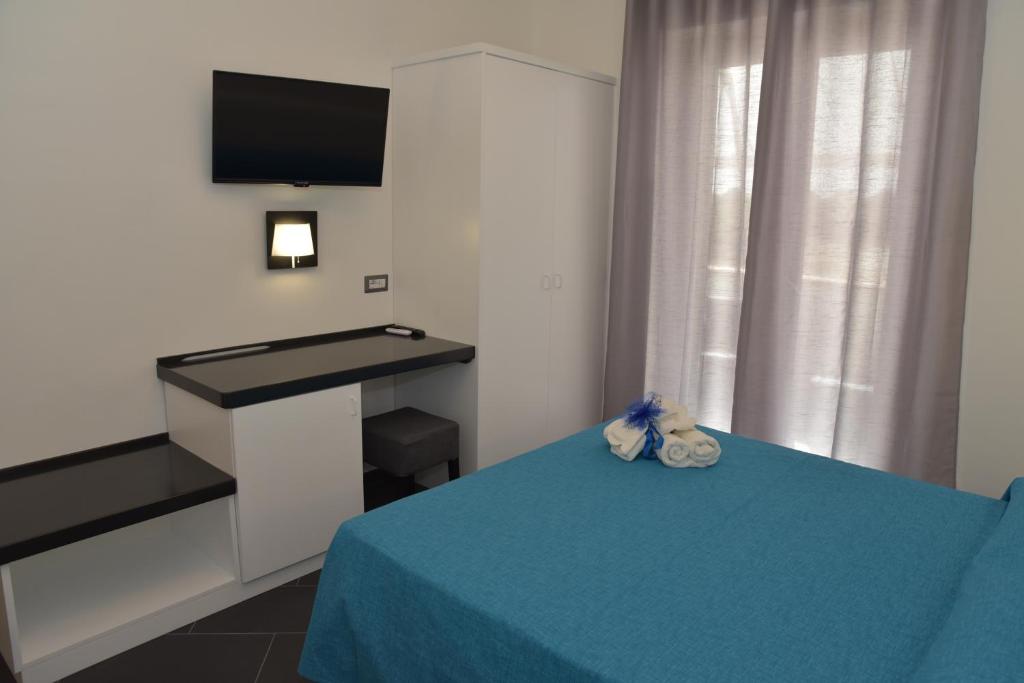 Posteľ alebo postele v izbe v ubytovaní B&b Tonyco