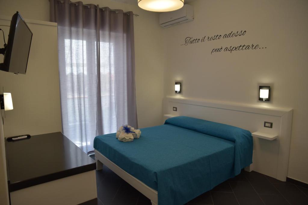 Posteľ alebo postele v izbe v ubytovaní B&b Tonyco
