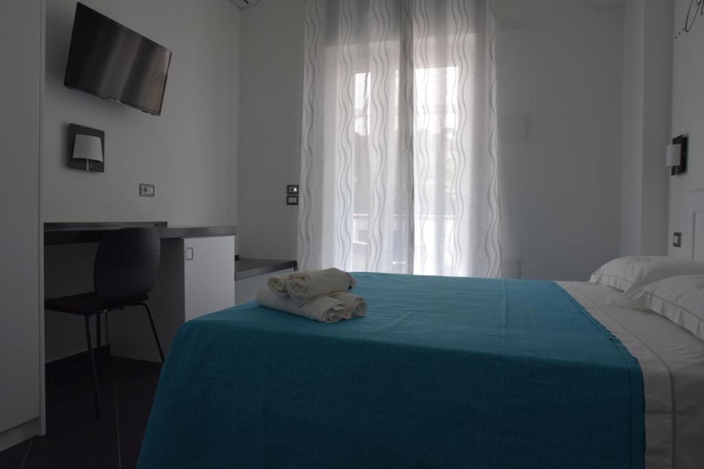 Posteľ alebo postele v izbe v ubytovaní B&b Tonyco