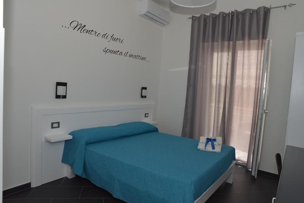 Posteľ alebo postele v izbe v ubytovaní B&b Tonyco