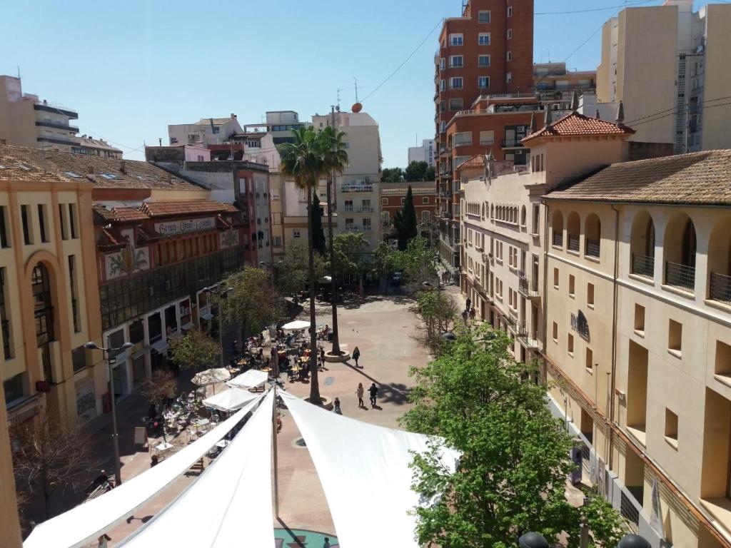 a view of a street with a white tent in a city at Los Palomitos, Casco Histórico VT-47255-V in Gandía