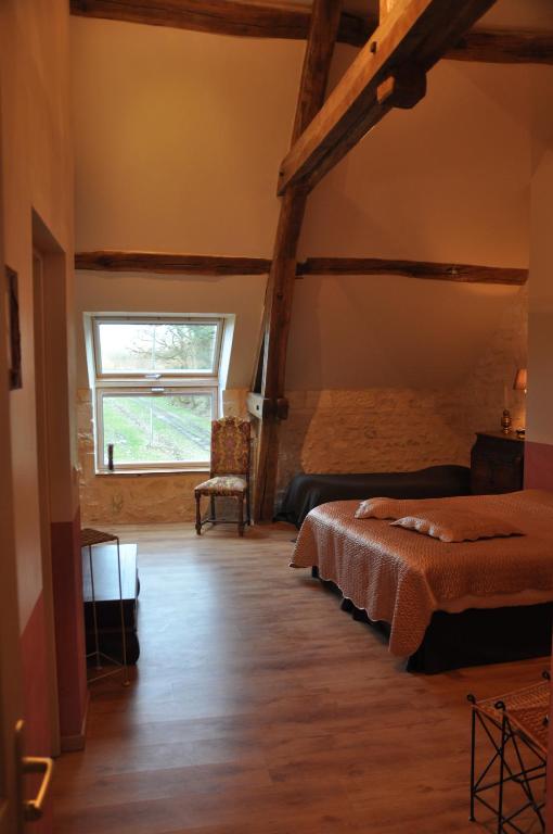 Postel nebo postele na pokoji v ubytování Les Pierres D'aurèle Chambres d'Hôtes