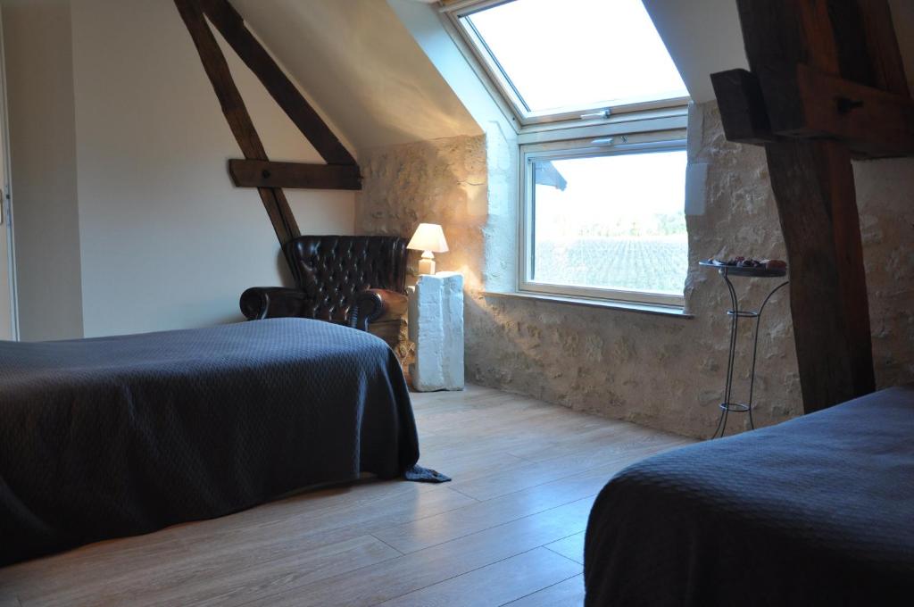 Postel nebo postele na pokoji v ubytování Les Pierres D'aurèle Chambres d'Hôtes