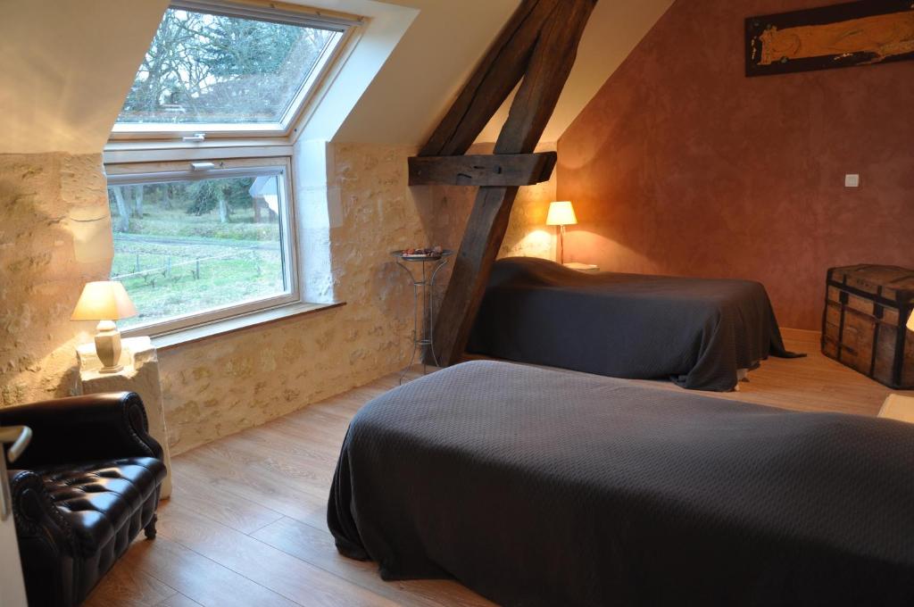 Postel nebo postele na pokoji v ubytování Les Pierres D'aurèle Chambres d'Hôtes