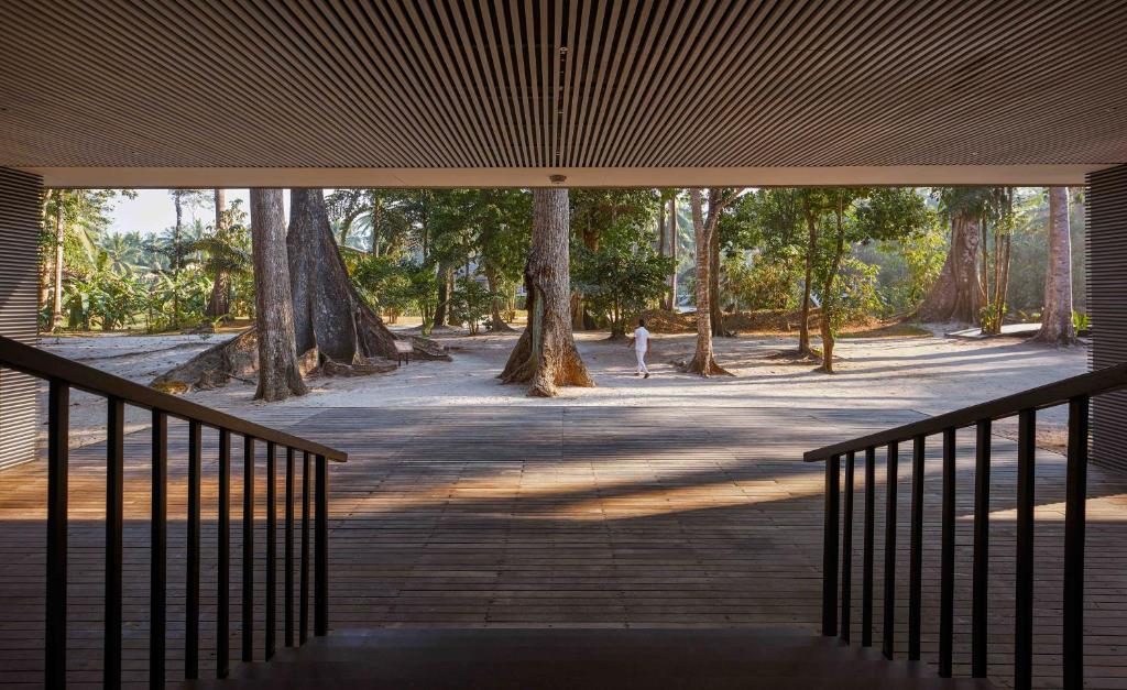 a view from the inside of a building with trees at Taj Exotica Resort & Spa, Andamans in Havelock Island