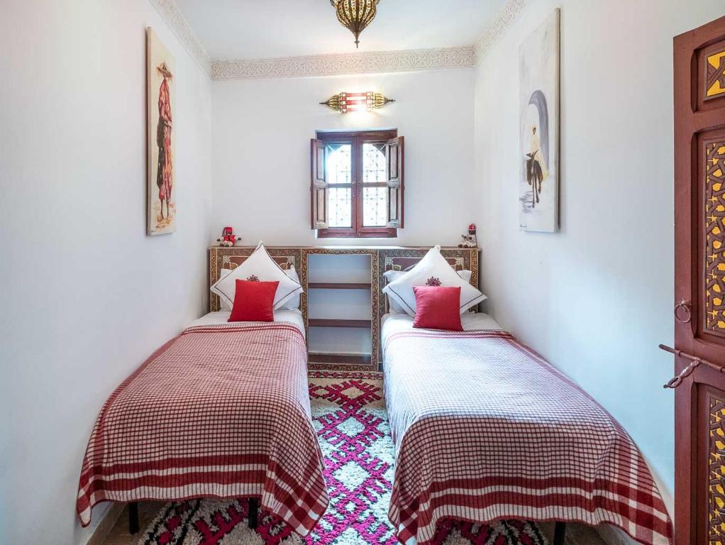 Postel nebo postele na pokoji v ubytování Riad Passali