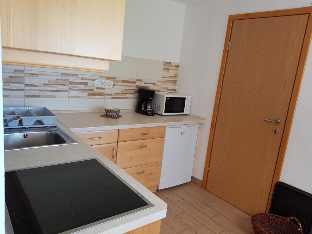 Kuchyň nebo kuchyňský kout v ubytování Vaznik Farm House Apartments